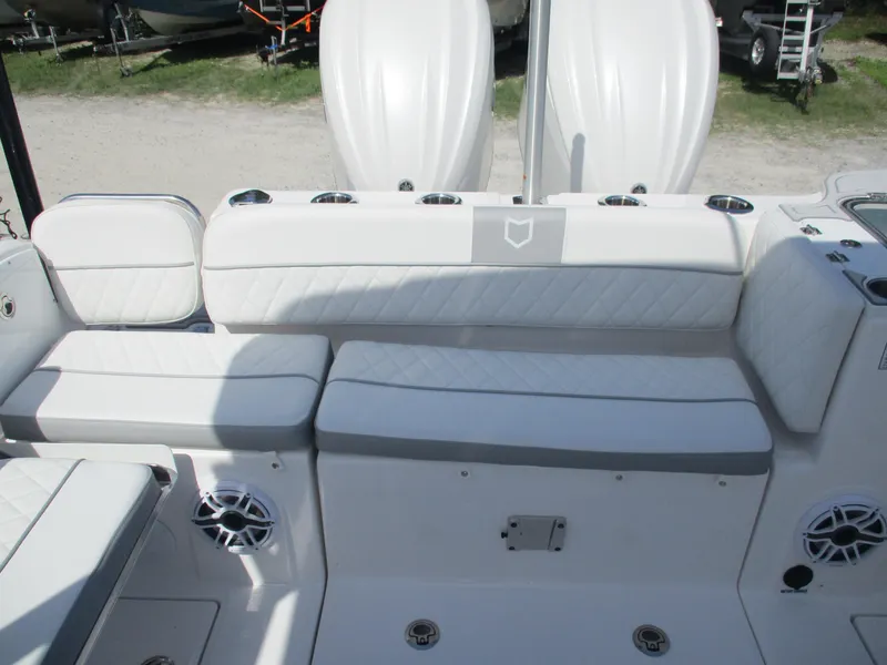 Slide: The Image of 2025 Sea Fox 288 Traveler boat interior with white seating and speakers. - 18