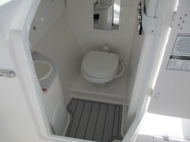Slide: The Image of 2025 Sea Fox 288 Traveler boat bathroom with toilet and sink, featuring modern design. - 20