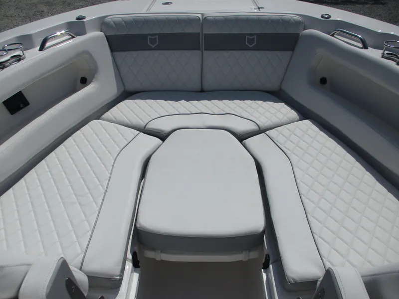 Slide: The Image of 2025 Sea Fox 288 Traveler boat interior with cushioned seating and diamond stitching. - 21