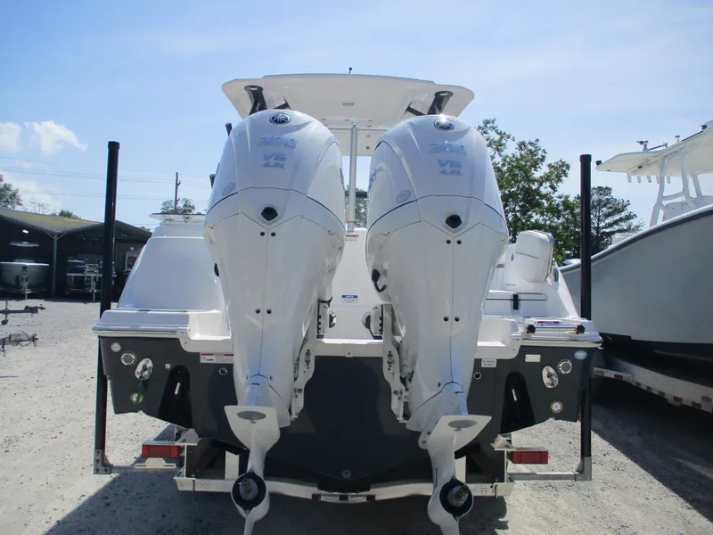 Slide: The Image of 2025 Sea Fox 288 Traveler boat with dual outboard engines, rear view. - 4