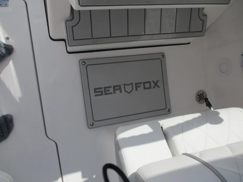 Slide: The Image of 2025 Sea Fox 288 Traveler boat interior with logo and seating. - 7