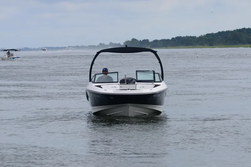 Slide: The Image of 2018 Sea Ray SPX 210 Outboard boat cruising on a calm lake. - 10