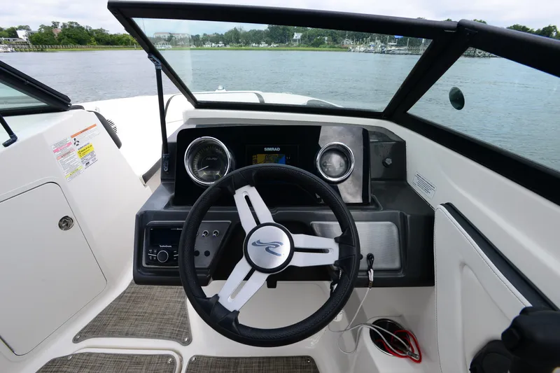 Slide: The Image of 2018 Sea Ray SPX 210 Outboard boat dashboard with steering wheel and instrument panel. - 16