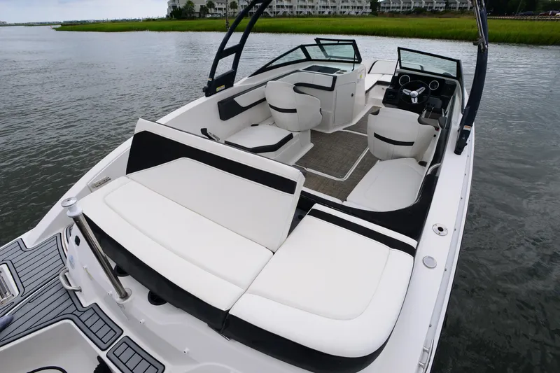 Slide: The Image of 2018 Sea Ray SPX 210 Outboard boat interior with white seating and sleek design. - 19