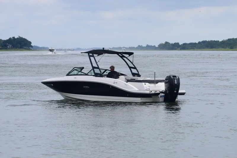Slide: The Image of 2018 Sea Ray SPX 210 Outboard boat cruising on a calm waterway. - 3