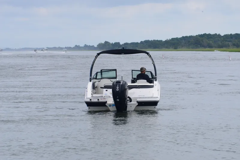 Slide: The Image of 2018 Sea Ray SPX 210 Outboard boat cruising on a calm waterway. - 4