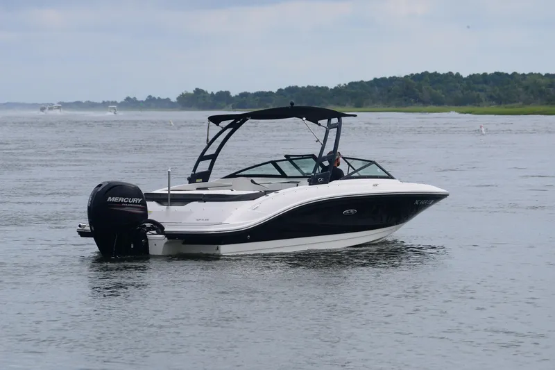 Slide: The Image of 2018 Sea Ray SPX 210 Outboard boat on calm water, featuring a sleek design. - 5