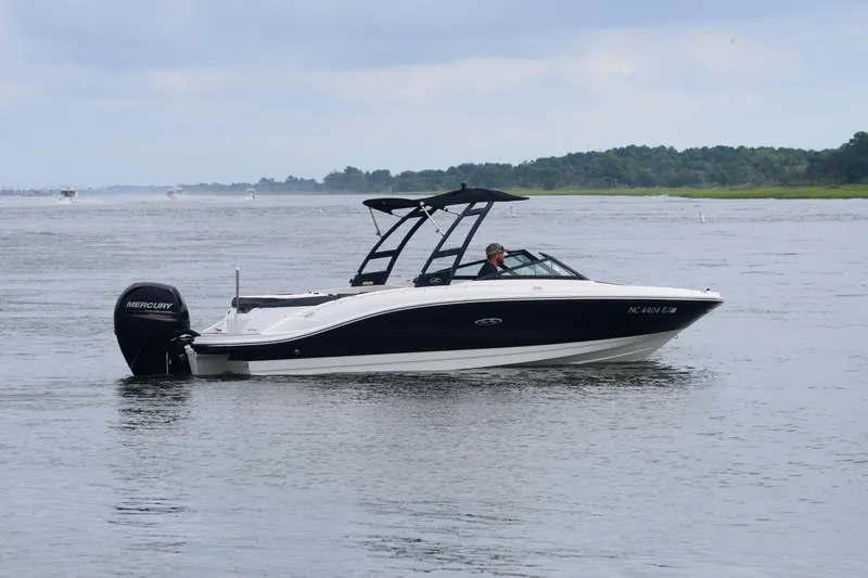 Slide: The Image of 2018 Sea Ray SPX 210 Outboard boat cruising on a calm lake. - 6