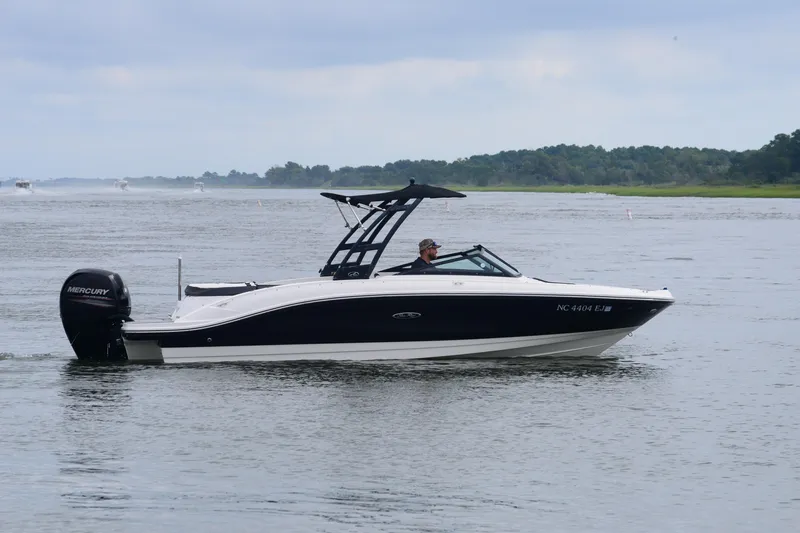 Slide: The Image of 2018 Sea Ray SPX 210 Outboard boat cruising on a calm lake. - 7