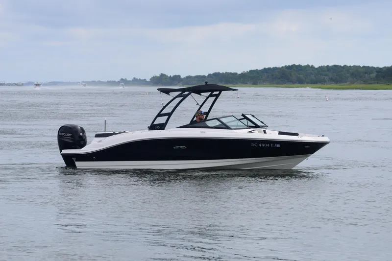 Slide: The Image of 2018 Sea Ray SPX 210 Outboard boat cruising on a calm lake. - 8