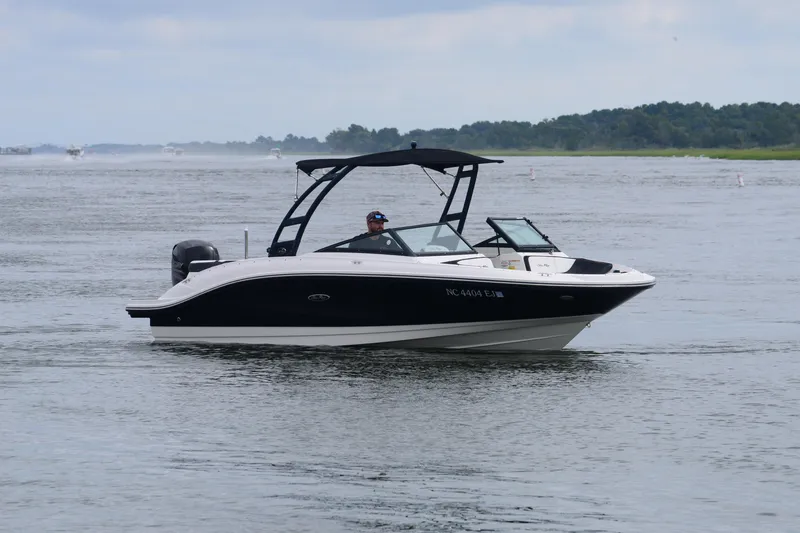Slide: The Image of 2018 Sea Ray SPX 210 Outboard boat cruising on a calm lake. - 9