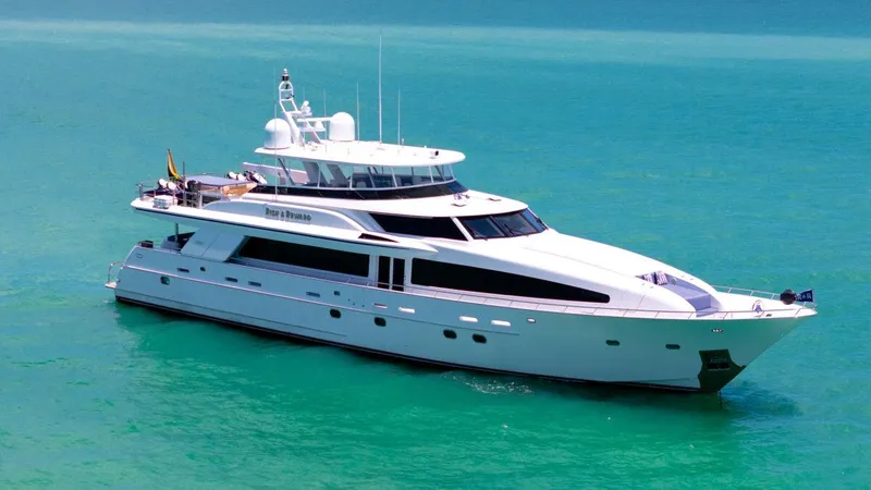The Image of Luxurious 2004 Crescent Raised Pilothouse yacht cruising on turquoise waters. - 1