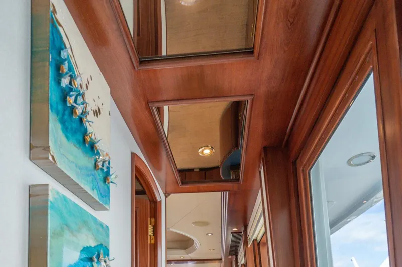 Slide: The Image of Luxurious interior of 2004 Crescent Raised Pilothouse yacht with wood paneling and artwork. - 11