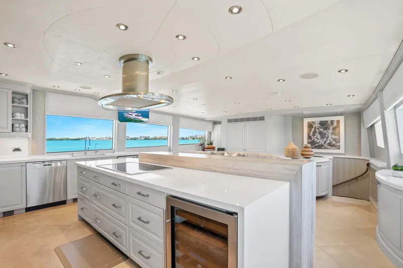 Slide: The Image of Luxurious yacht kitchen with modern design, featuring large windows and sleek cabinetry, Crescent Raised Pilothouse 2004. - 12