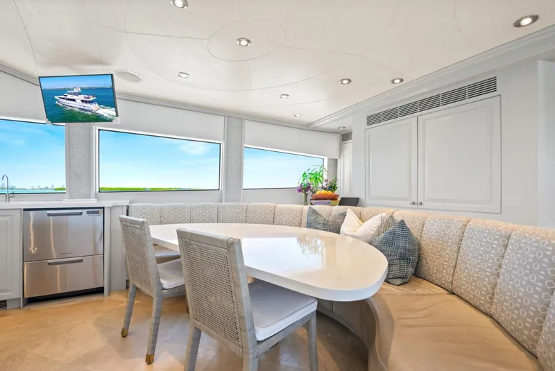 Slide: The Image of Luxurious Crescent Raised Pilothouse 2004 yacht interior with elegant dining area and scenic views. - 17