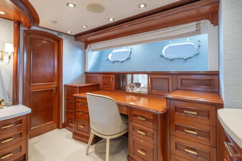 Slide: The Image of Luxurious wooden interior of 2004 Crescent Raised Pilothouse yacht with desk and porthole windows. - 19