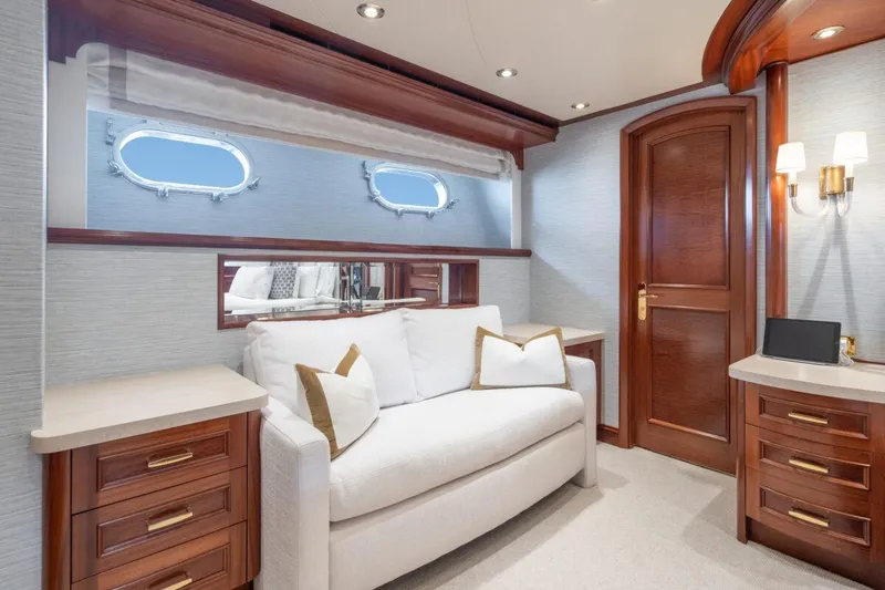 Slide: The Image of Luxurious yacht interior with elegant wood finishes, white sofa, and porthole windows, Crescent Raised Pilothouse 2004. - 20