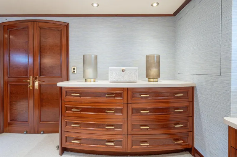 Slide: The Image of Luxurious wooden dresser in Crescent Raised Pilothouse yacht, 2004 model, with elegant decor. - 21