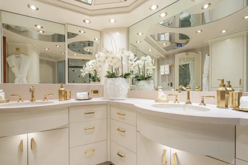 Slide: The Image of Luxurious bathroom with gold fixtures, mirrors, and elegant decor on a 2004 Crescent Raised Pilothouse yacht. - 22
