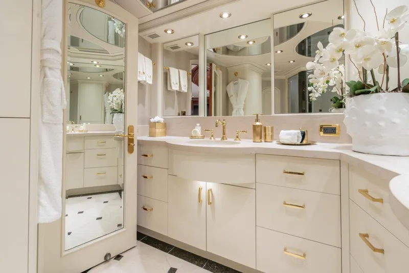 Slide: The Image of Luxurious yacht bathroom with elegant fixtures, mirrors, and floral decor, Crescent Raised Pilothouse 2004. - 23