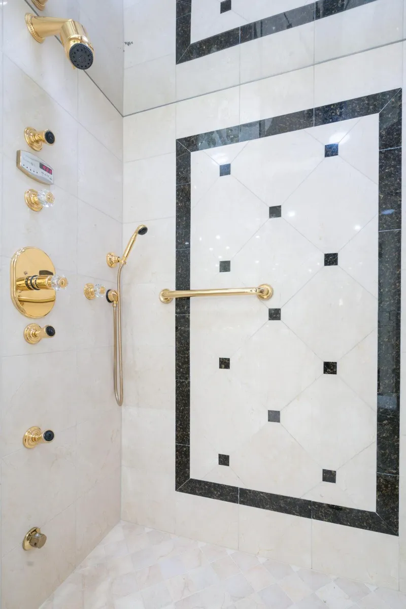 Slide: The Image of Luxurious shower with gold fixtures and elegant black-and-white tile design, Crescent Raised Pilothouse 2004. - 25