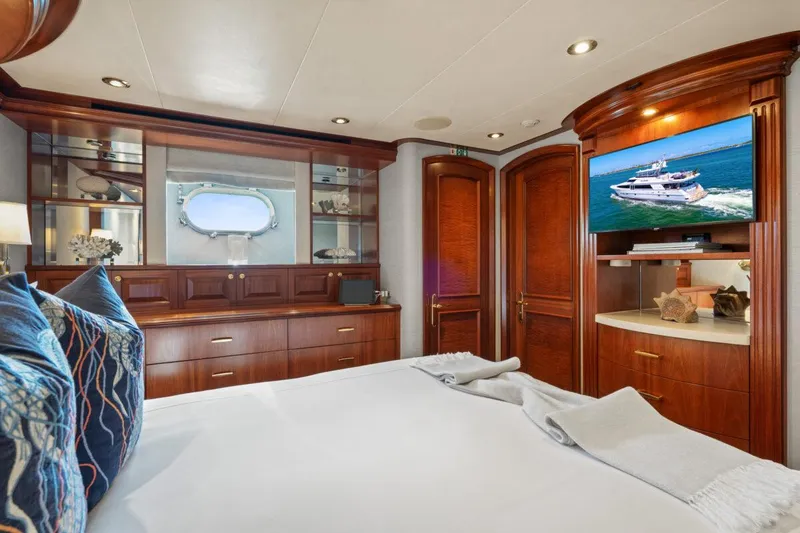 Slide: The Image of Luxurious bedroom interior on 2004 Crescent Raised Pilothouse yacht with elegant wood finishes. - 29