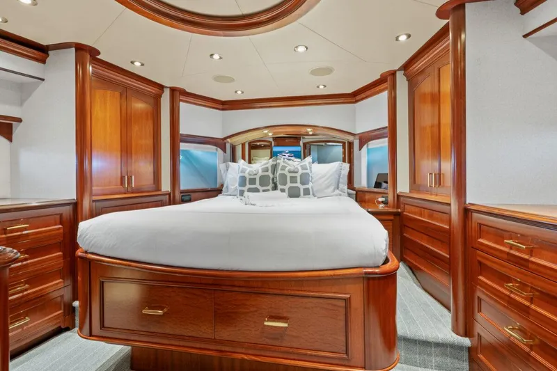 Slide: The Image of Luxurious Crescent Raised Pilothouse 2004 yacht bedroom with elegant wood finish and plush bedding. - 30