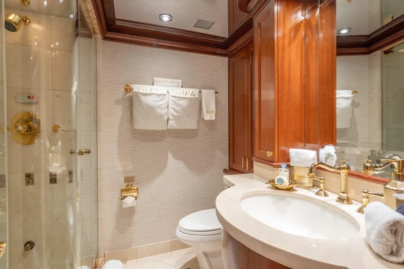 Slide: The Image of Luxurious bathroom in 2004 Crescent Raised Pilothouse yacht with elegant fixtures and wood accents. - 31