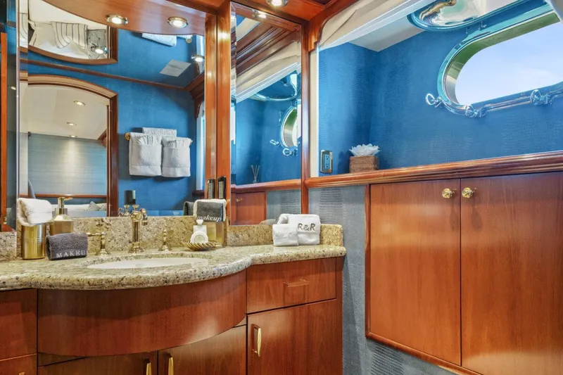 Slide: The Image of Luxurious bathroom in 2004 Crescent Raised Pilothouse yacht with elegant wood cabinetry and granite countertop. - 33