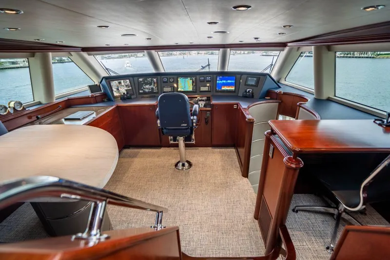 Slide: The Image of Luxurious 2004 Crescent Raised Pilothouse interior with navigation controls and panoramic windows. - 37