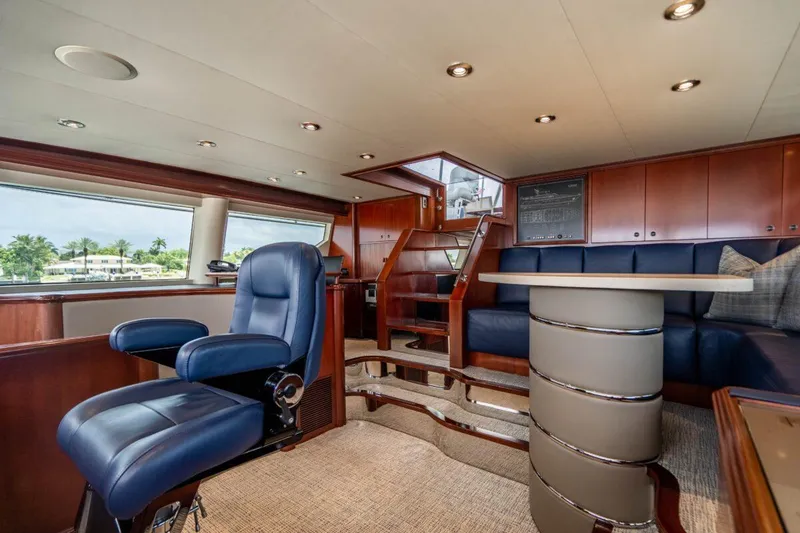 Slide: The Image of Luxurious interior of 2004 Crescent Raised Pilothouse yacht with plush seating and elegant design. - 44