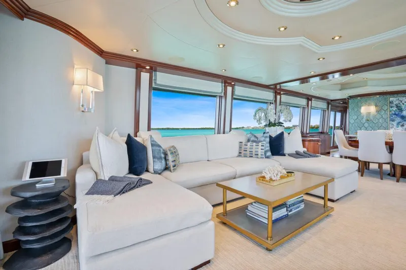 Slide: The Image of Luxurious Crescent Raised Pilothouse yacht interior, 2004 model, featuring elegant seating and ocean views. - 5