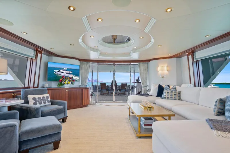 Slide: The Image of Luxurious Crescent Raised Pilothouse yacht interior, 2004 model, featuring elegant seating and ocean views. - 6