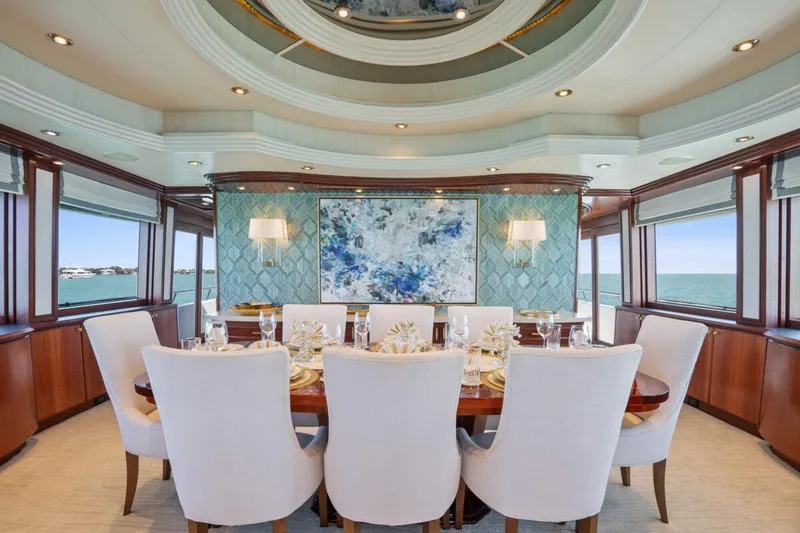 Slide: The Image of Luxurious dining area on 2004 Crescent Raised Pilothouse yacht with elegant decor and ocean views. - 9