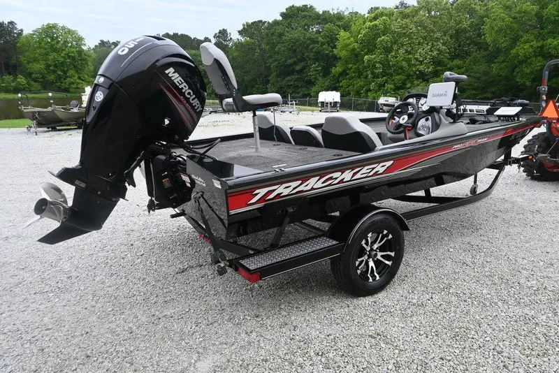 Slide: The Image of 2016 Tracker Pro Team™ 195 TXW boat with Mercury engine on gravel lot. - 11