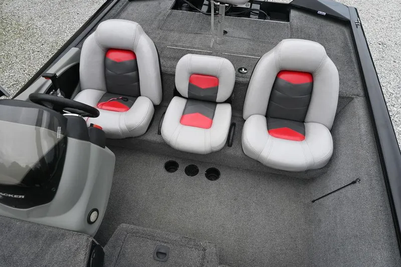 Slide: The Image of 2016 Tracker Pro Team™ 195 TXW boat interior with three gray and red seats. - 5