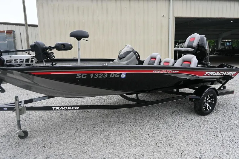 Slide: The Image of 2016 Tracker Pro Team™ 195 TXW fishing boat on trailer, parked outdoors. - 9