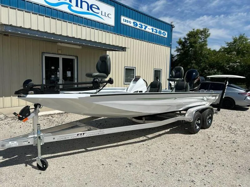 Slide: The Image of 2025 Xpress H20C Crappie boat on trailer outside dealership. - 1