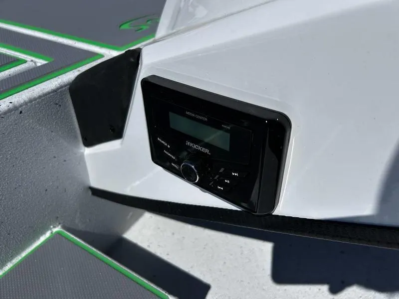 Slide: The Image of 2025 Xpress H20C Crappie boat with Kicker media center installed. - 11