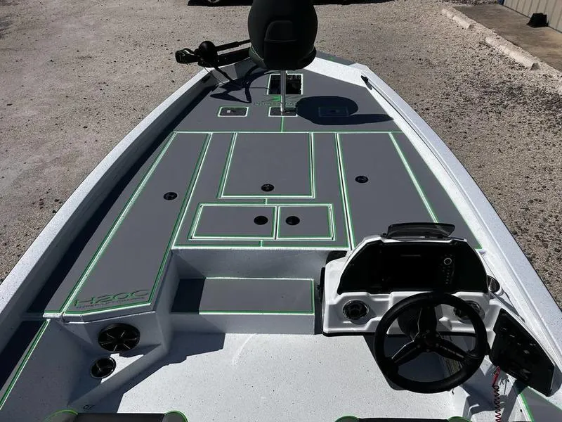 Slide: The Image of 2025 Xpress H20C Crappie boat interior with modern design and steering console. - 13