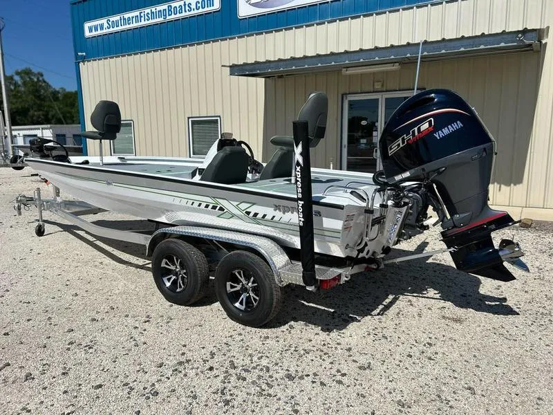 Slide: The Image of 2025 Xpress H20C Crappie boat with Yamaha engine, parked outside Southern Fishing Boats. - 4