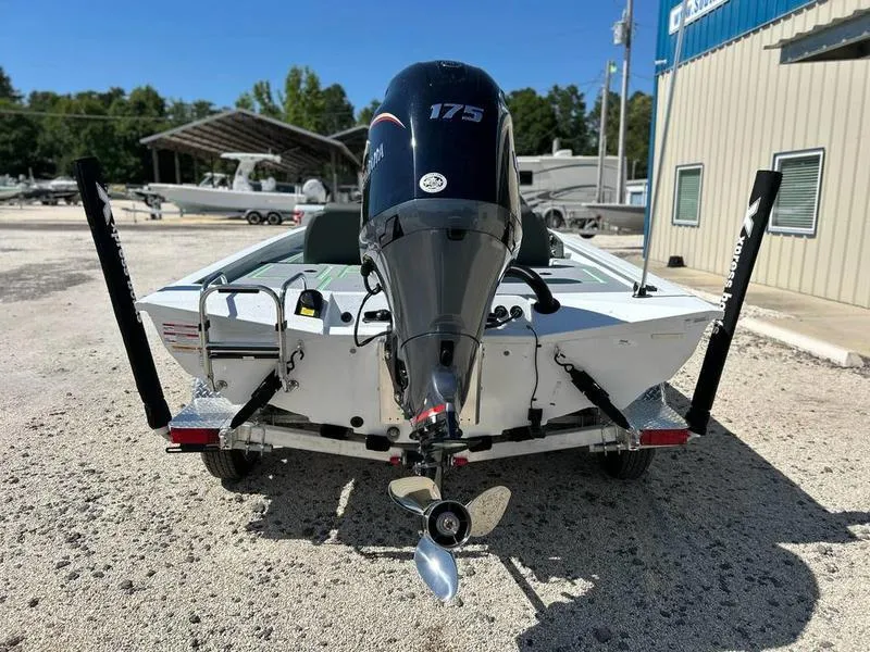 Slide: The Image of 2025 Xpress H20C Crappie boat with 175 horsepower engine, parked outdoors. - 5
