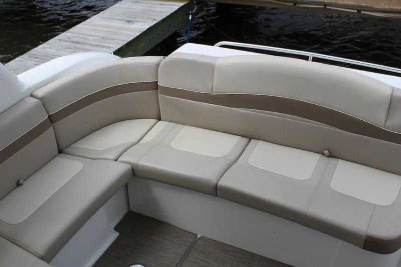 Slide: The Image of 2016 Formula 37 PC boat with beige leather seating near a dock. - 11