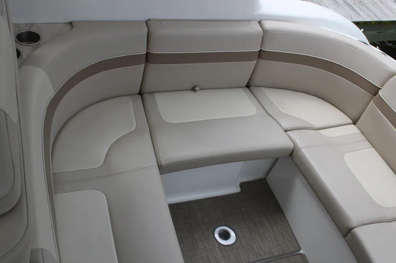 Slide: The Image of 2016 Formula 37 PC boat interior with beige seating and cup holder. - 12