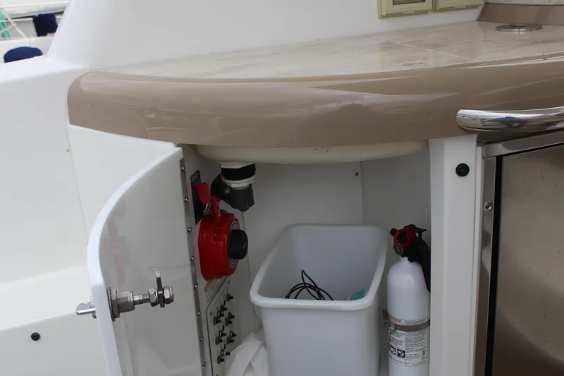 Slide: The Image of 2016 Formula 37 PC yacht interior storage with fire extinguisher and bin. - 14