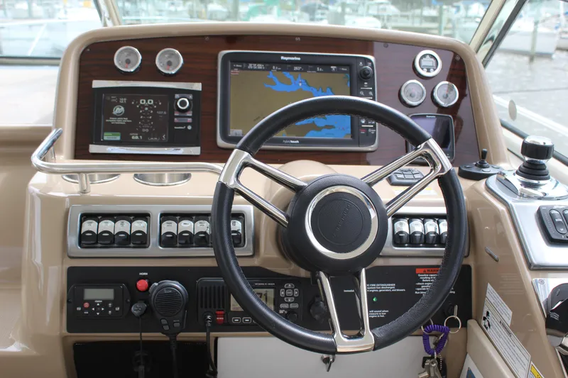 Slide: The Image of 2016 Formula 37 PC helm with navigation screens and controls. - 17