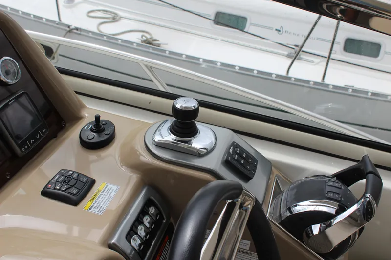 Slide: The Image of Control panel of a 2016 Formula 37 PC yacht with steering wheel and joystick. - 19