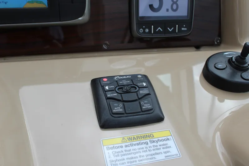 Slide: The Image of Control panel of a 2016 Formula 37 PC boat with Skyhook activation warning. - 23