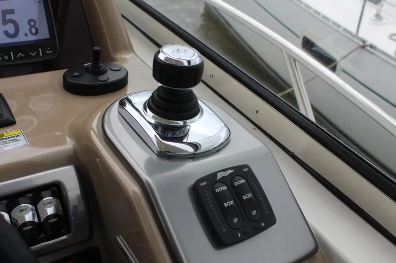 Slide: The Image of Control panel of a 2016 Formula 37 PC boat with joystick and buttons. - 25