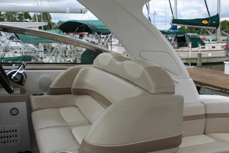 Slide: The Image of 2016 Formula 37 PC yacht interior with beige leather seating at marina. - 26